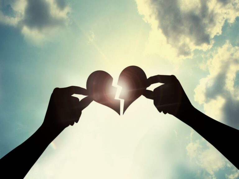 Overcoming Barriers To Being Close To God Broken heart with each half held by a hand and being put together with sun and sky in the background